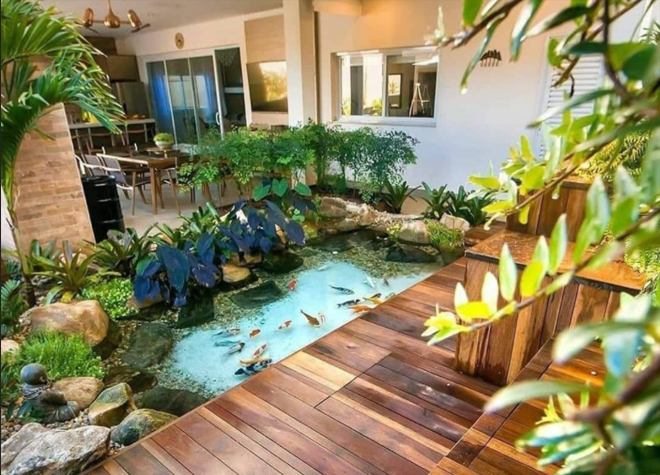 rumah sejuk dengan kolam ikan